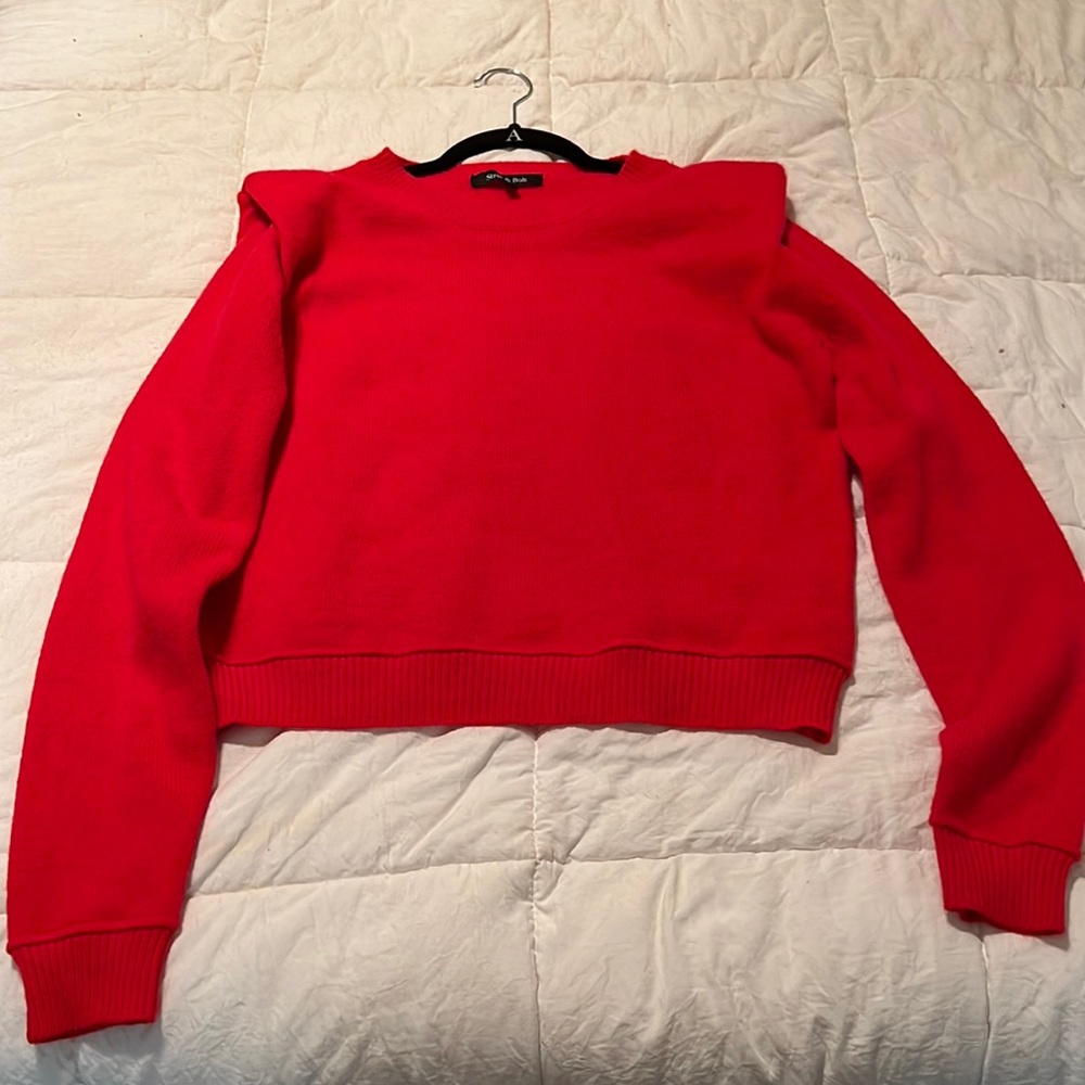 Red shoulder pad sweater